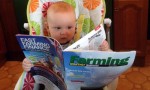 baby reading magazine